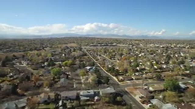 HIDDEN LAKE COLORADO-2016: Aerial View Of Town Showing Clouds Sky Houses Roads