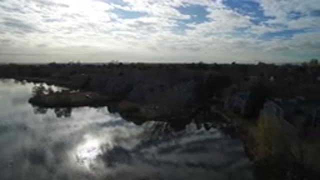 HIDDEN LAKE COLORADO-2016: On The Banks Of A River A City Can Be Glimpsed