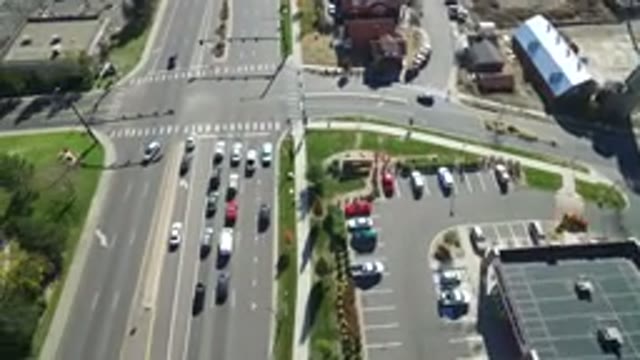 HIDDEN LAKE COLORADO-2016: Cars On A Not So Busy Street By A Parking Lot