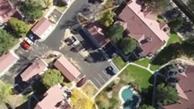 HIDDEN LAKE COLORADO-2016: Aerial View Of Suburb With Homes Roads Cars And Trees