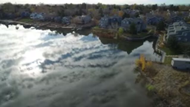 HIDDEN LAKE COLORADO-2016: Body Of Water Surrounded By Houses With The Sky
