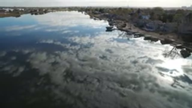 HIDDEN LAKE COLORADO-2016: Overhead View of Placid Water with Cloud Reflections