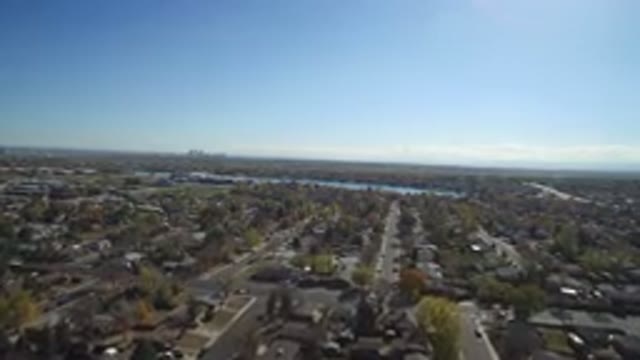 HIDDEN LAKE COLORADO-2016: Aerial Filming Of A Suburban Neighborhood With Houses And Blue Sky