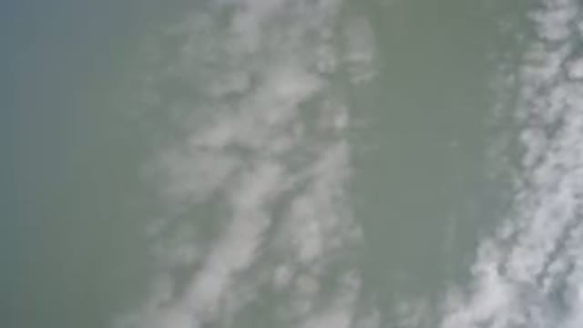 HIDDEN LAKE COLORADO-2016: Looking Up At Thin White Clouds And Blueish Gray Sky