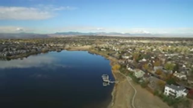 HIDDEN LAKE COLORADO-2016: Aerial View of Body of Water with Blue Sky and Cloud Reflections