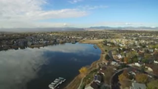HIDDEN LAKE COLORADO-2016: Aerial Shot Of A Town By A Lake On A Clear Sunny Day