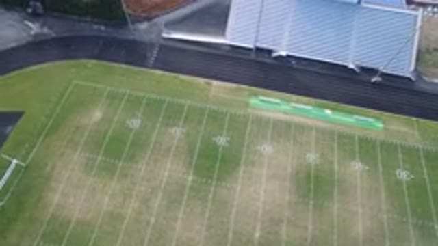 HIDDEN LAKE COLORADO-2016: An Aerial View Of A Green Football Field And A Track