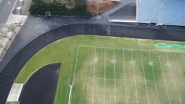 HIDDEN LAKE COLORADO-2016: An Aerial View Of A Green Football Field Surrounded