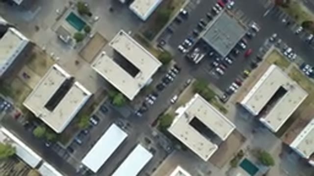 HIDDEN LAKE COLORADO-2016: Industrial Area With Buildings And Cars Parked Around