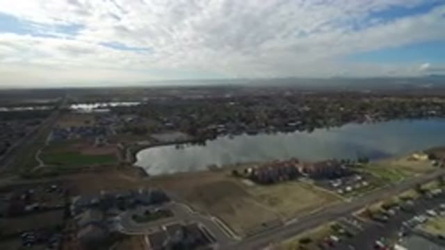 HIDDEN LAKE COLORADO-2016: The Aerial View Of A Large City Surrounded By Houses