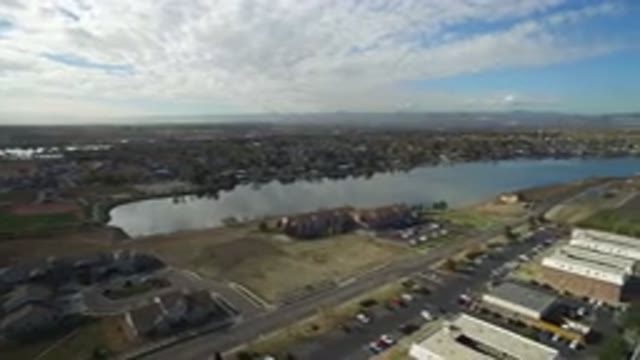 HIDDEN LAKE COLORADO-2016: Aerial Footage Of A Small Lake Trees Cars Buildings