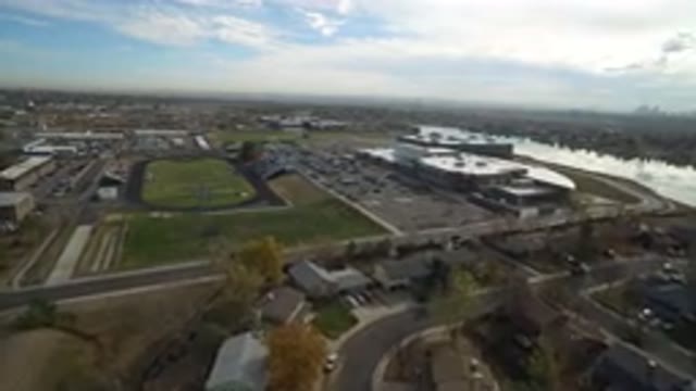 HIDDEN LAKE COLORADO-2016: Flyover Shot Of Building Green Grass And Surrounding