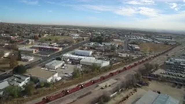 HIDDEN LAKE COLORADO-2016: Business Area With A Train And Cars Moving In The