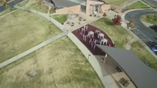 HIDDEN LAKE COLORADO-2016: Aerial View Of A Garden With Green Grass And Two