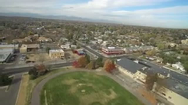 HIDDEN LAKE COLORADO-2016: Daytime Aerial View Of A City Depicting Elements Such
