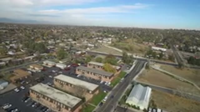 HIDDEN LAKE COLORADO-2016: Aerial View Of A Small Flat Town With Trees And Roads
