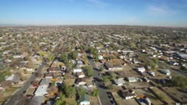 HIDDEN LAKE COLORADO-2016: Camera Spanning Aral View Over Large Green Suburb