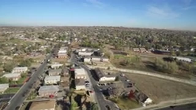 HIDDEN LAKE COLORADO-2016: Drone View of Suburban Area on a Sunny Day with Small River and Big Buildings