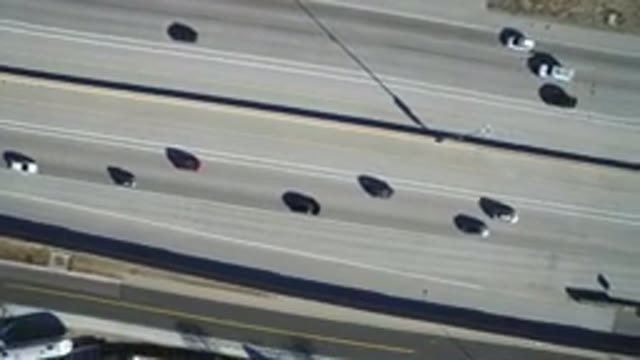 HIDDEN LAKE COLORADO-2016: The Moving Cars On The Highway Look Like Toys Racing