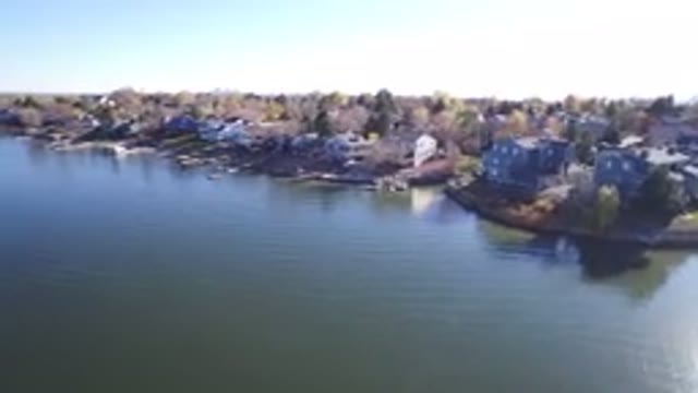 HIDDEN LAKE COLORADO-2016: Lake House With Boats Parked Outside