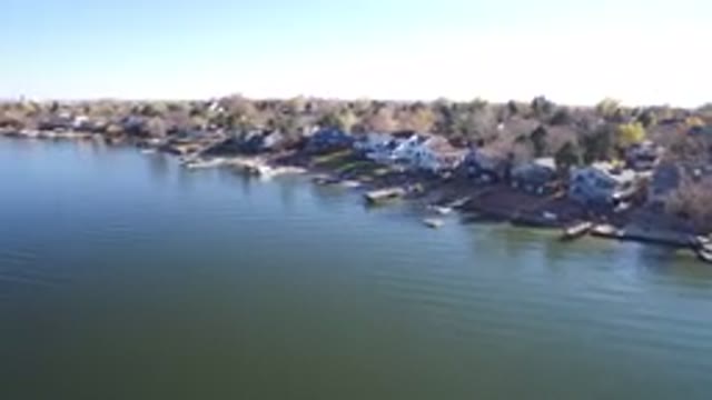 HIDDEN LAKE COLORADO-2016: Aerial View Of Large Lake Or Riverside With Town