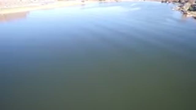 HIDDEN LAKE COLORADO-2016: Camera Panning Across Still Water Showing Reflection