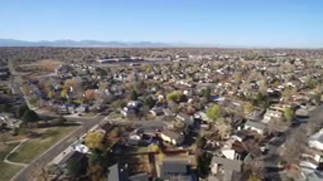 HIDDEN LAKE COLORADO-2016: Rotating Shot From High Up Over Houses and Trees