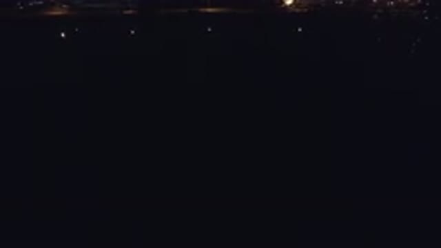 DENVER COLORADO-2016: Dark Night-Time View With Lights On Side Of Waterfront