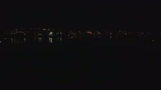 DENVER COLORADO-2016: The Reflection of City Lights on Water in the Dark