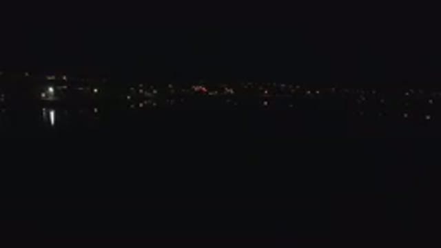 DENVER COLORADO-2016: Flying At Night Time Over A City The Sky Is Very Dark