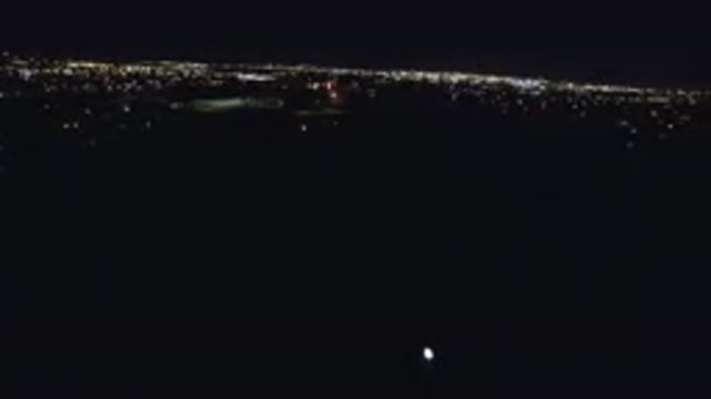 DENVER COLORADO-2016: Aerial View At Night Of City Lights And Horizon With Black
