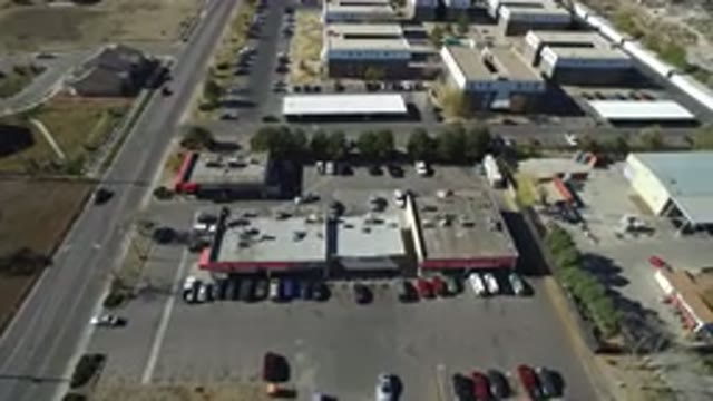 WESTMINSTER COLORADO-2016: Sunny Overhead View Of Few Cars In Industrial Parking