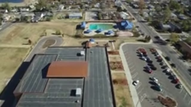 WESTMINSTER COLORADO-2016: Camera Passes Over A Large Building And A Pool With