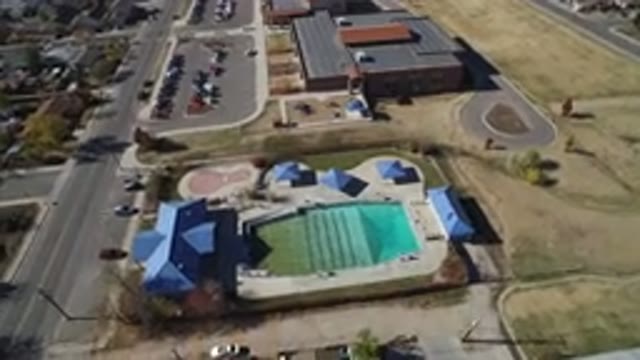 WESTMINSTER COLORADO-2016: Aerial View Of Buildings With Blue Roofs And Swimming Pool