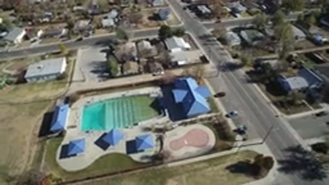 WESTMINSTER COLORADO-2016: Plane Flying Over A Field With Houses And Trees