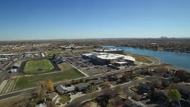 HIDDEN LAKE COLORADO-2016: Aerial View Of A Suburban Town Next To A Small Lake