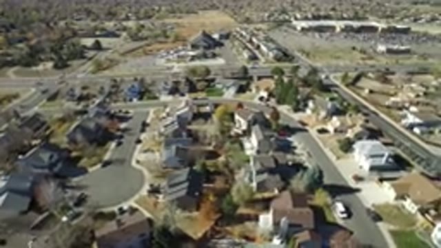 HIDDEN LAKE COLORADO-2016: Buildings Sit Side By Side In A Small Town Cars Are Passing