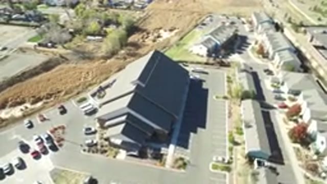 HIDDEN LAKE COLORADO-2016: Large Building With Parked Cars And Some Houses