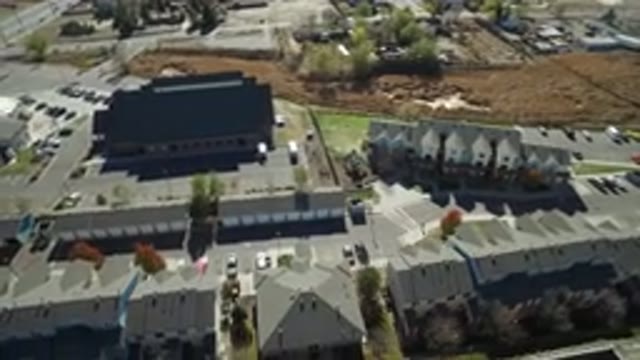 HIDDEN LAKE COLORADO-2016: Drone Flying Over A Factory And A Little Field