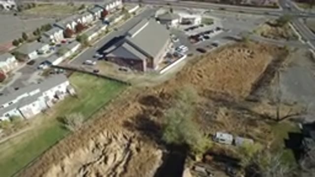 HIDDEN LAKE COLORADO-2016: Parking Place With Cars Around A Big Construction