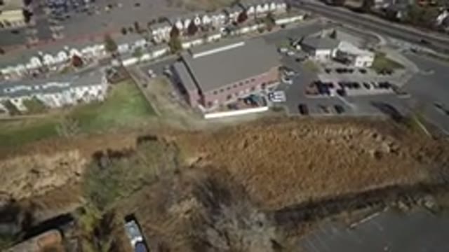 HIDDEN LAKE COLORADO-2016: Drone Shot Of Large Building With Parking Lot Almost Full