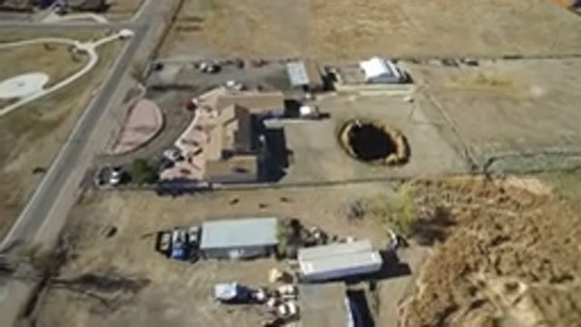 HIDDEN LAKE COLORADO-2016: Aerial View Of Terrain With Ground Hole And Buildings
