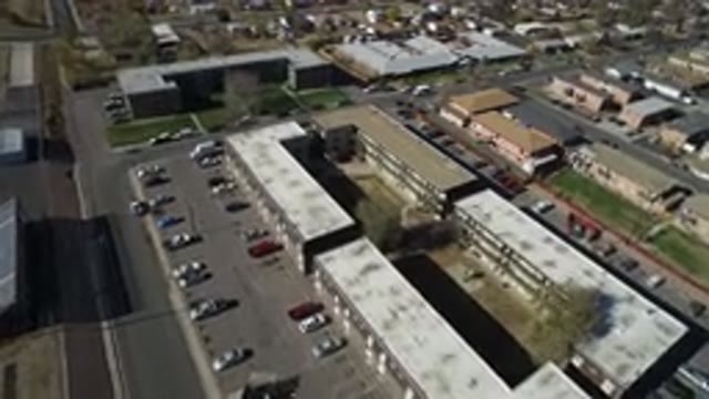 WESTMINSTER COLORADO-2016: A Top View Of A City With Buildings And Water Around