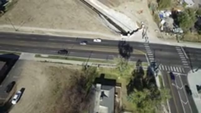 WESTMINSTER COLORADO-2016: Aerial View Of A Road With Four Cars On It And Some