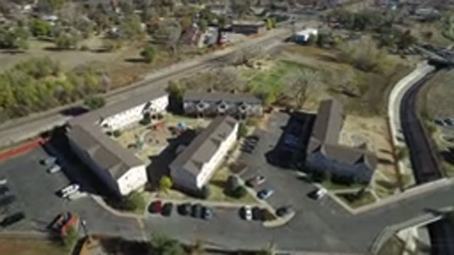 WESTMINSTER COLORADO-2016: Large Buildings With Cars Parked In The Parking Lot A