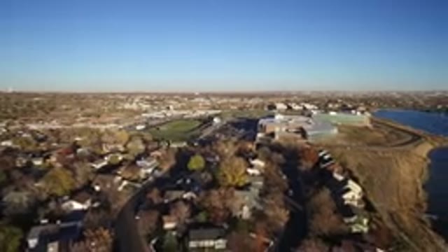 WESTMINSTER COLORADO-2016: Air Filming A City With Houses Trees A Stadium And A Lake