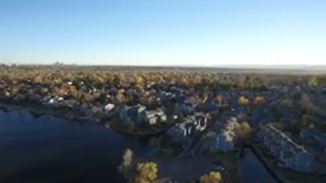 WESTMINSTER COLORADO-2016: Aerial View Of Building & Homes Surrounding A Body Of Water
