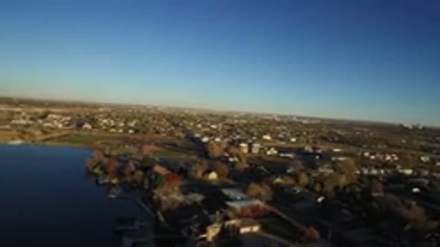 WESTMINSTER COLORADO-2016: Aerial Camera Shows Suburbs In Foreground With Urban