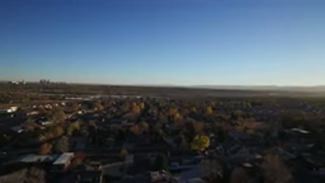 WESTMINSTER COLORADO-2016: An Aerial Camera Flying Over A City With Lots Of Houses And Trees