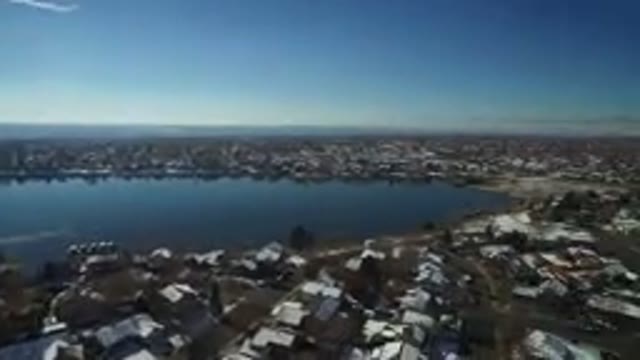 HIDDEN LAKE COLORADO-2016: Aerial View Of Town With Lake And Many Houses And Mountains
